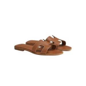 Hermès Oran sandals in Gold brown leather