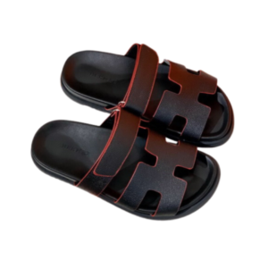 Hermès Cyprus sandals in black with contrasting red trim