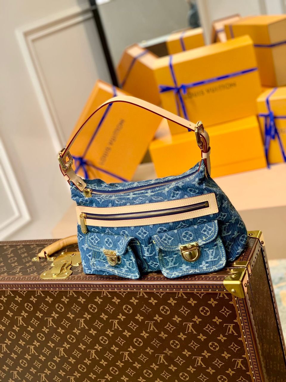 Louis Vuitton Monogram Denim Baggy PM bag in blue denim canvas.
