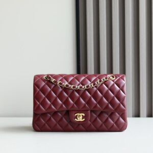 Chanel Classic Double Flap Medium bag in burgundy lambskin leather with gold hardware.