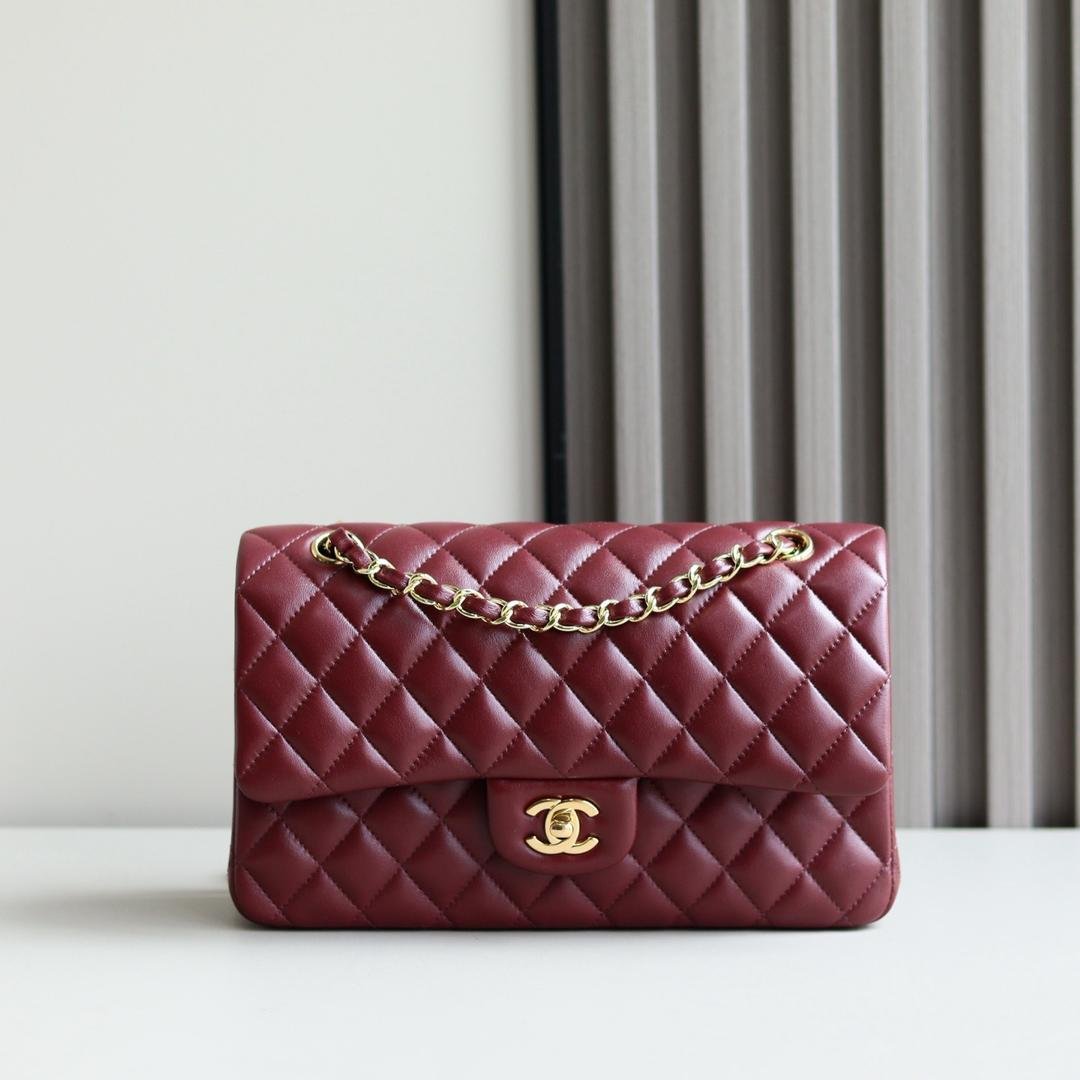 Chanel Classic Double Flap Medium bag in burgundy lambskin leather with gold hardware.
