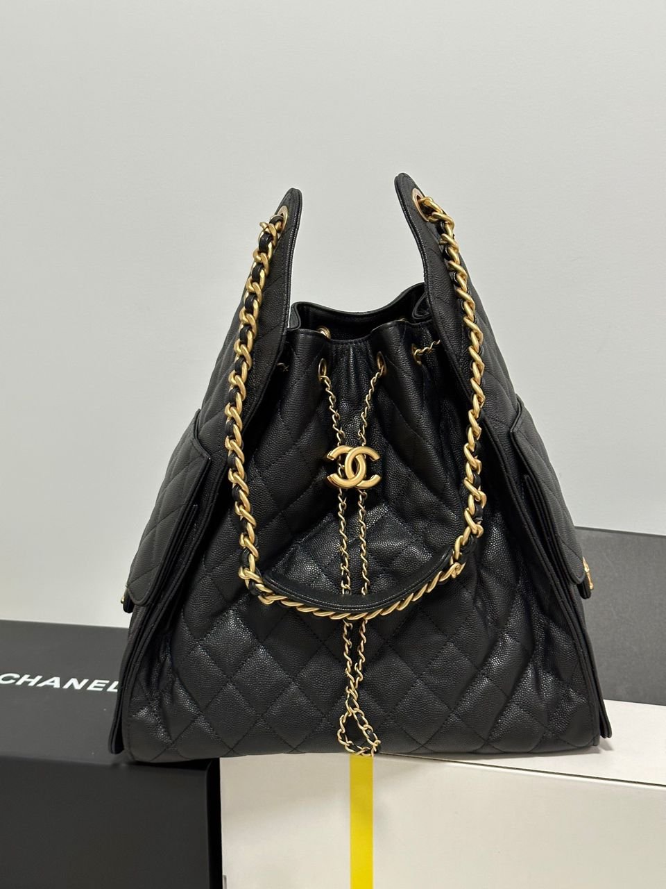 Chanel 19 in black quilted leather with gold chain
